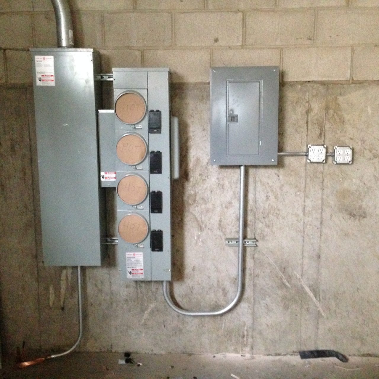 Four-position meter bank with service equipment and panel