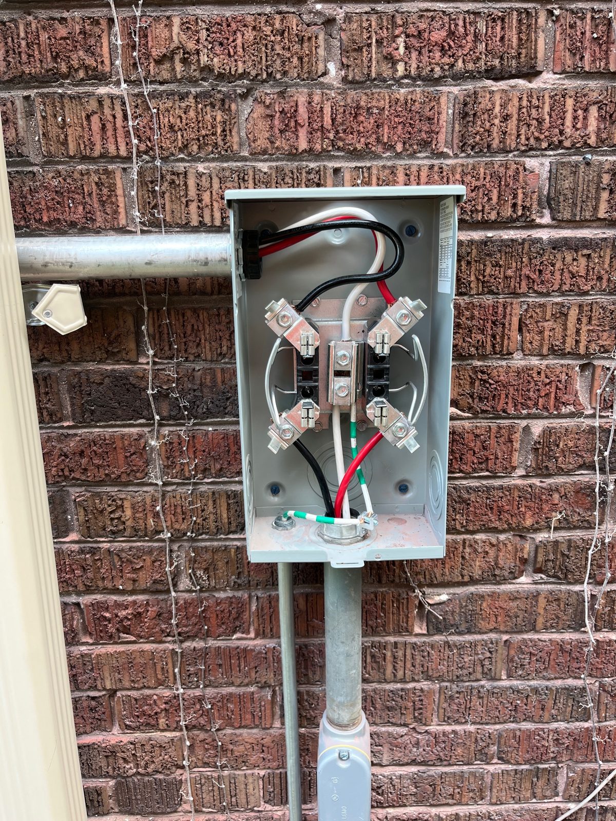 Exterior meter socket wired and ready for the meter