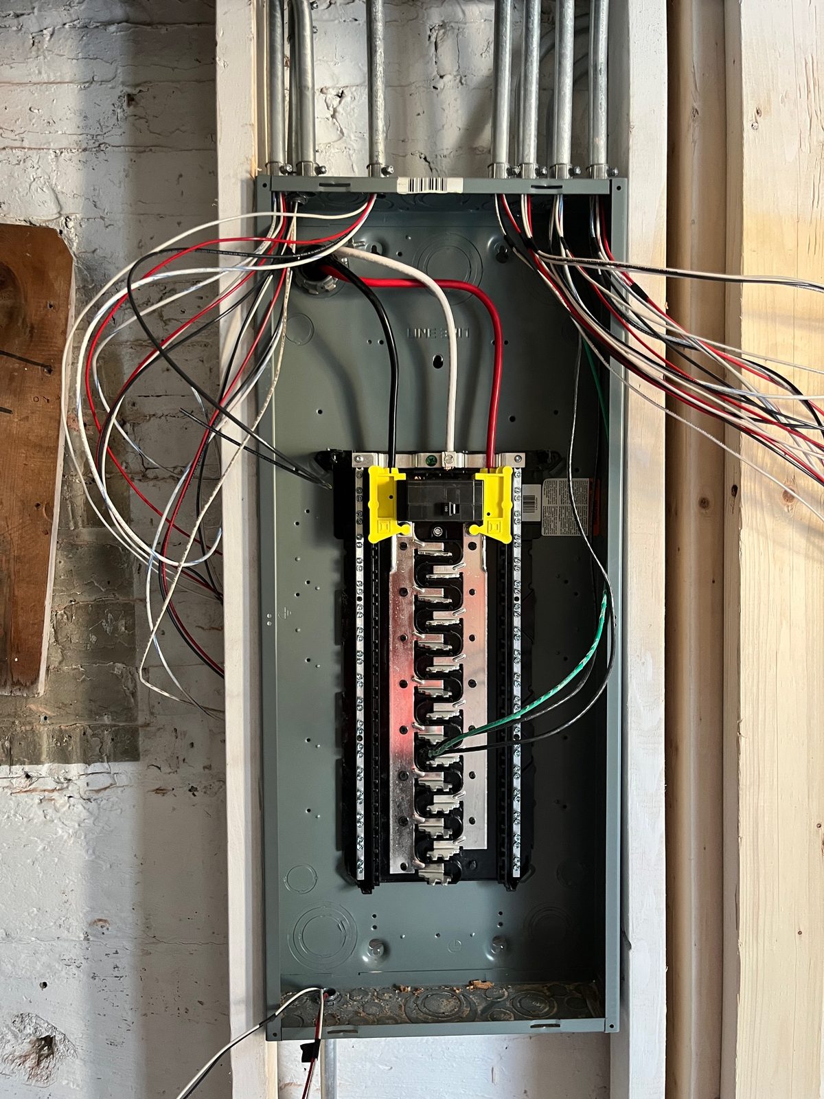 New load center with branch circuit wiring in a basement